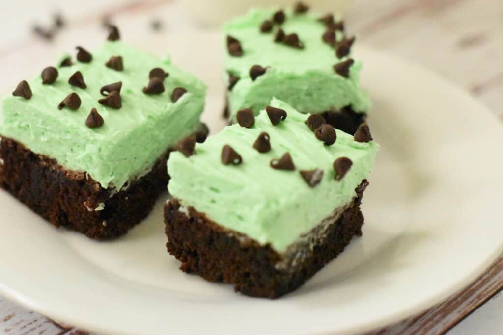 Brownies with mint cream cheese icing and chocolate chips. 