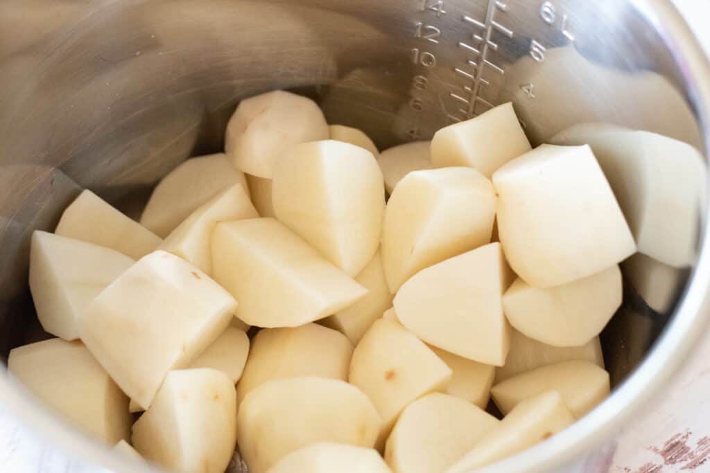 Chopped potatoes in the pot of an Instant pot
