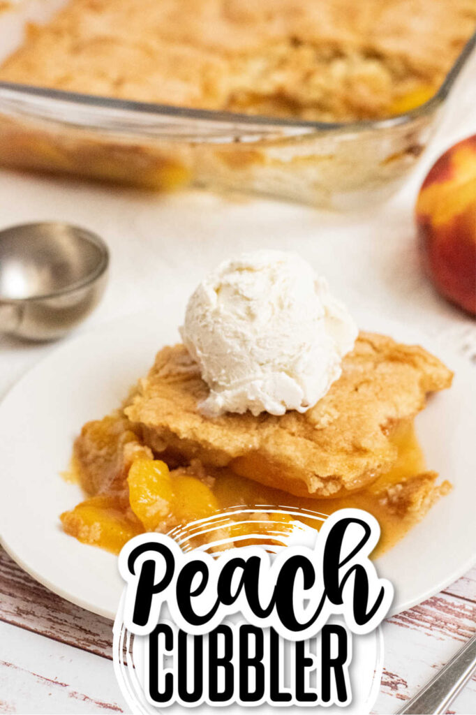 A piece of peach cobbler topped with vanilla ice cream on a white plate. 