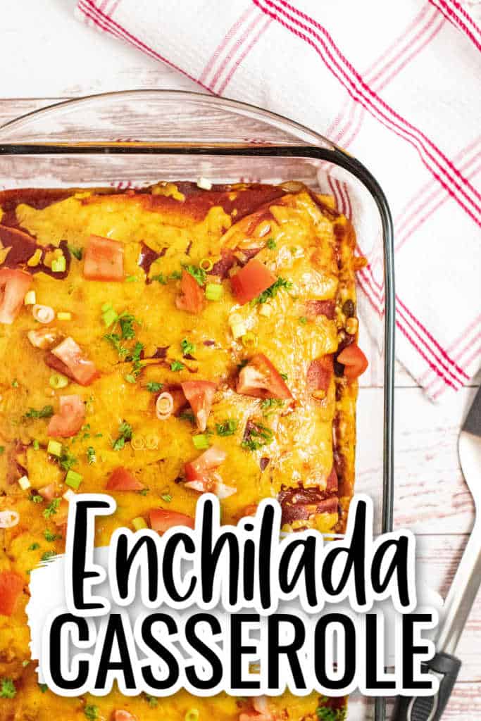 A glass baking pan with cheese topped enchilada casserole