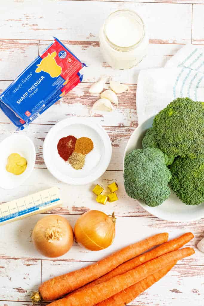 Ingredients for broccoli cheese soup cheese, broccoli, half and half, spices, butter, onions, carrots & garlic
