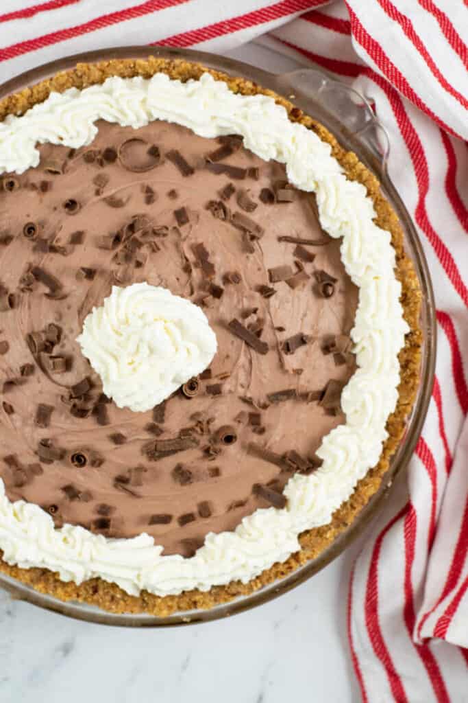A chocolate pie in a glass pie pan