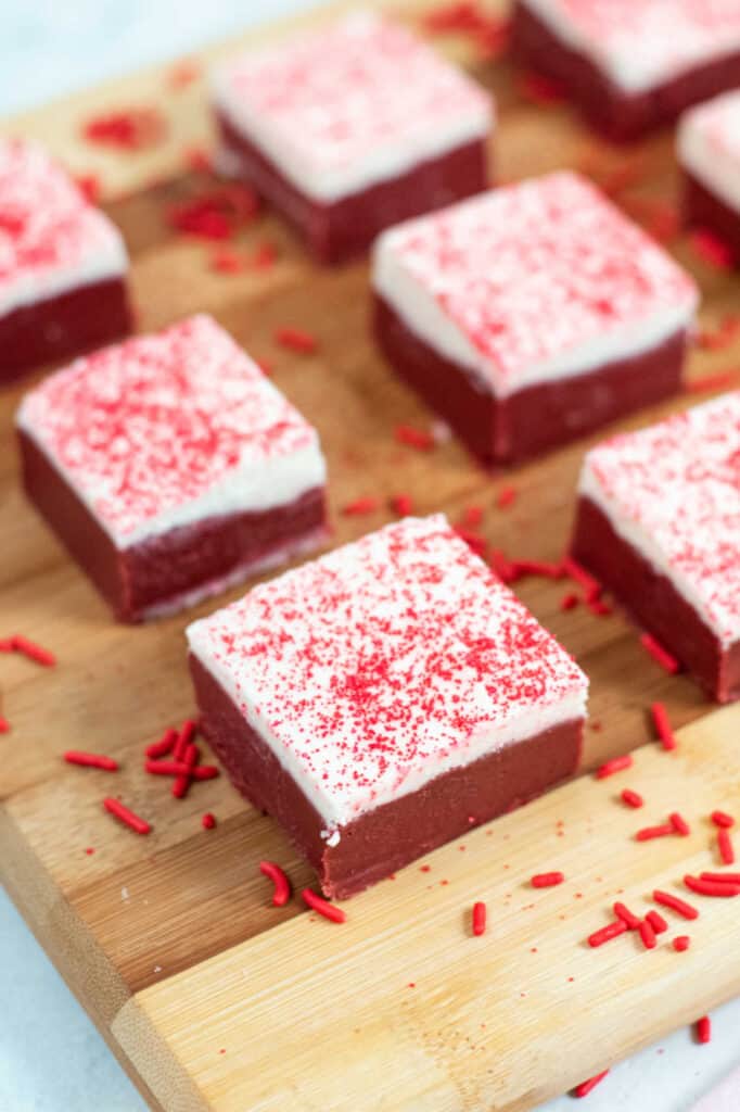 red velvet fudge on a wooden chopping board