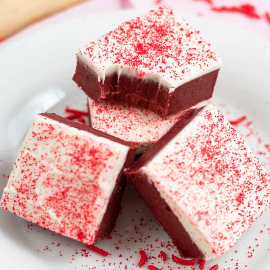 A stack of red velvet fudge on a white plate 
