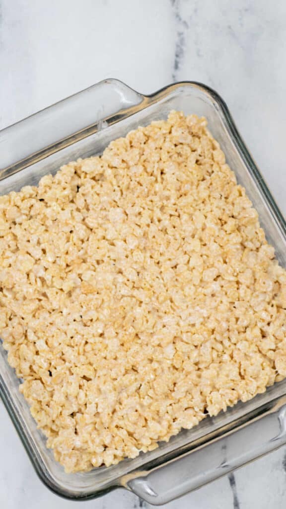 A square pan with rice cereal treats. 