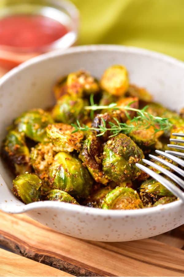 A bowl full of roasted brussels sprouts. 