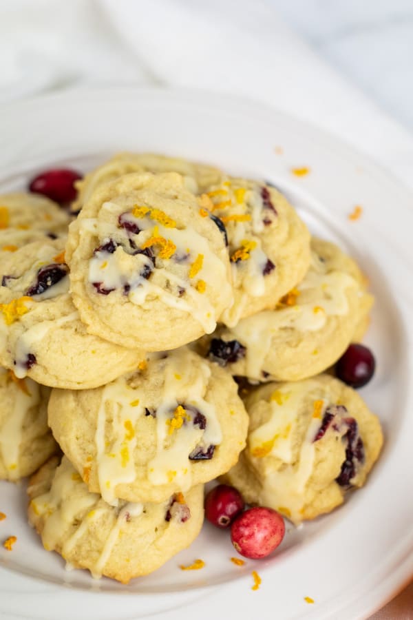 A plate piled with orange cranberry cookies