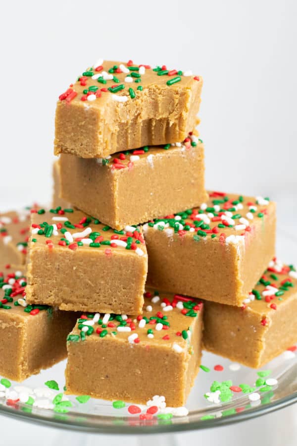 A stack of gingerbread fudge on a glass plate. 