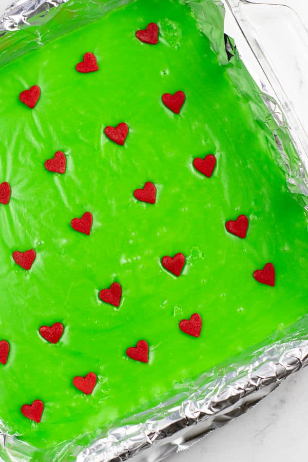 A pan of green fudge with red hearts in rows of 5 