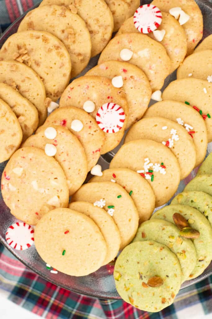 A close up of four different variations of slice and bake cookies on a tray. 
