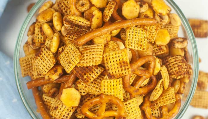 An overhead view of a glass bowl of air fryer chex mix.
