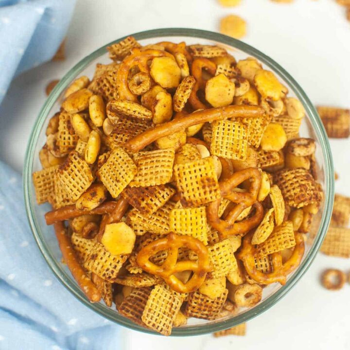 An overhead view of a glass bowl of air fryer chex mix.