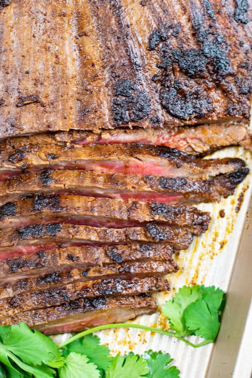 A close-up of a sheet pan of carne ranchero.