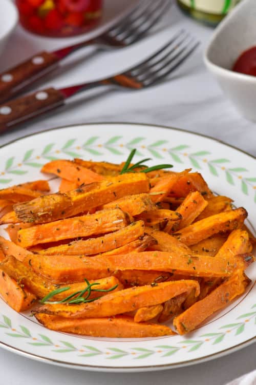 A white plate of air fryer sweet potato fries.