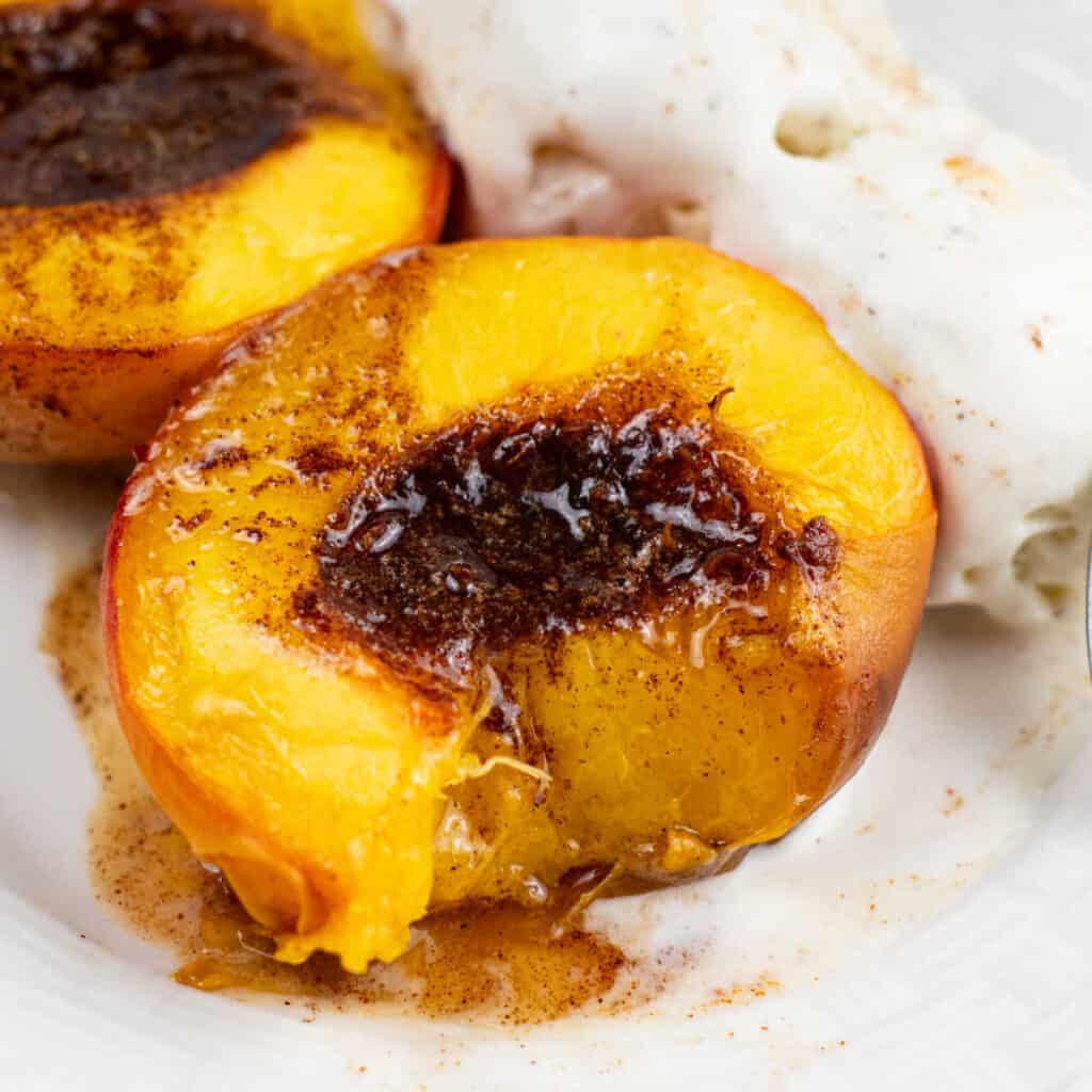 A close up of an air fryer peach with a bite taken out
