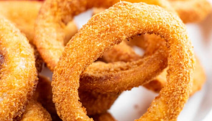 a close up of an air fryer onion ring