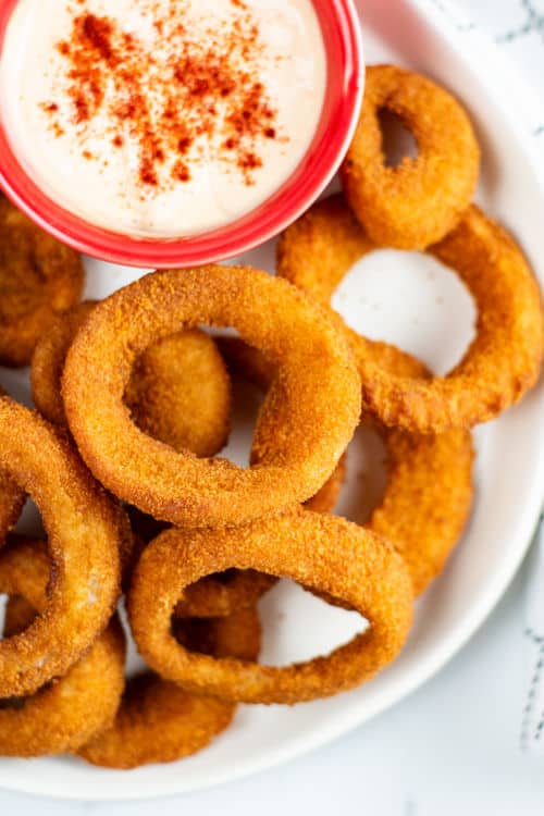 an overhead shot of a plate of onion rings