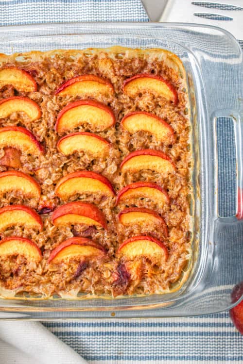 a glass baking pan full of peach baked oatmeal
