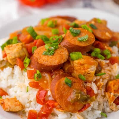 A plate of slow cooker cajun chicken and sausage over a bed of rice